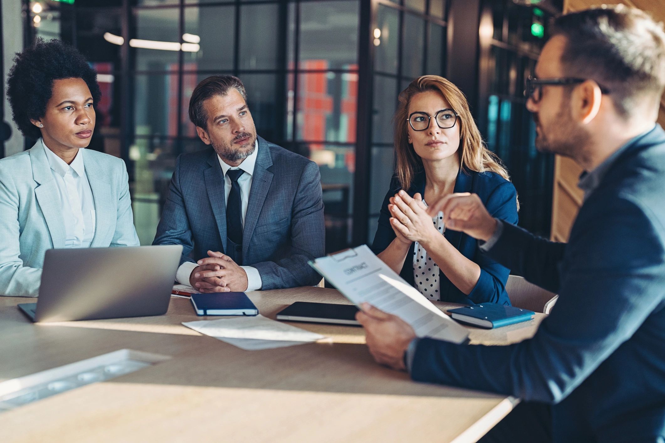 Investment team meeting in a modern office